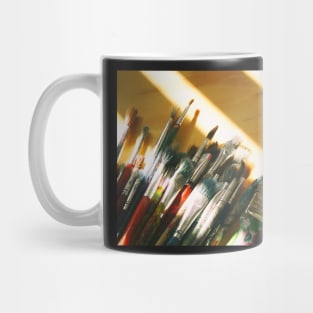 Art brushes on a wood table Mug